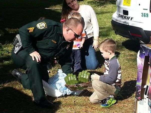 Firefighters, Offices, and local kids celebrating this lovely oy’s birthday