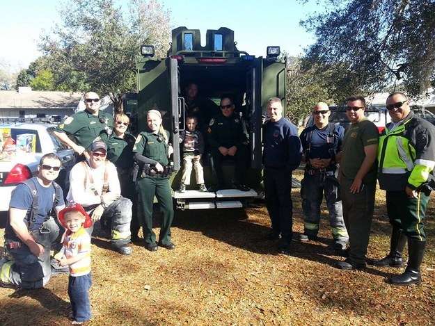 Firefighters, Offices, and local kids celebrating this lovely oy’s birthday