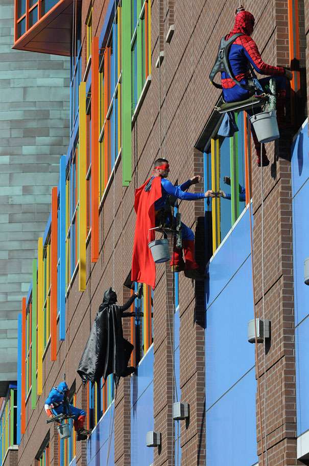 Team of window cleaners dressed up as superheroes to cheer up children at the hospital