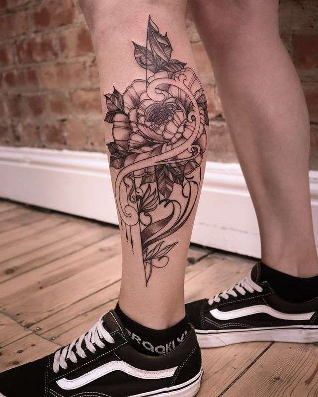 leg tattoos for women, lower leg tattoos for women, lower leg tattoo designs for women, female thigh tattoos history, history of female lower leg tattoos