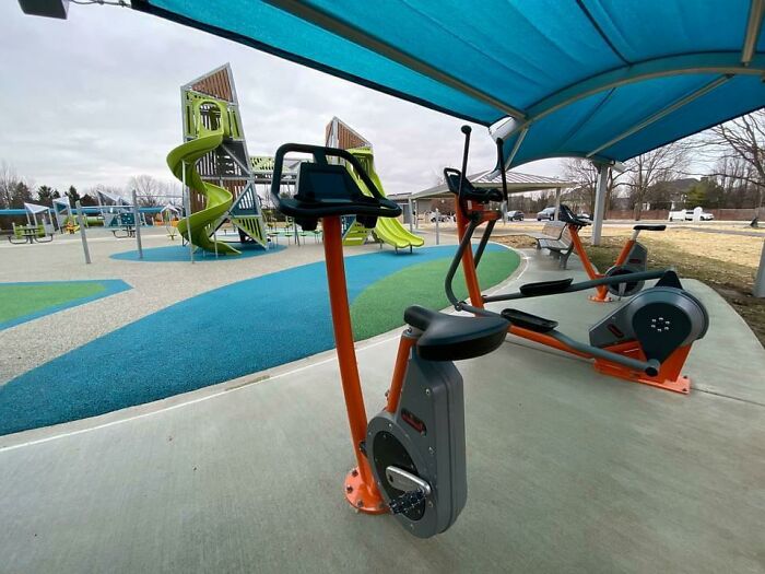 This park has workout equipment that placed facing the playground