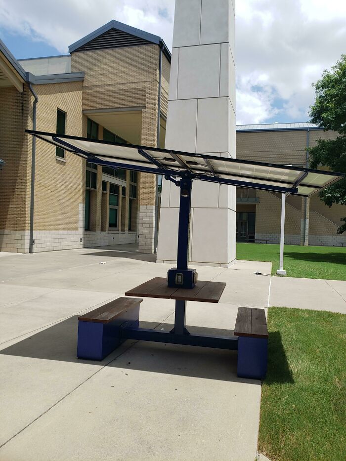 This table is inside a campus; it uses solar panels for the shades, and it allows to get power to the charging ports on the table