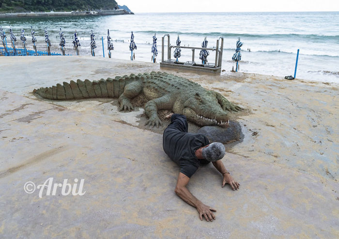 realistic crocodile sand sculpture