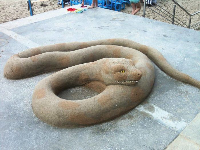 giant snake sand sculpture