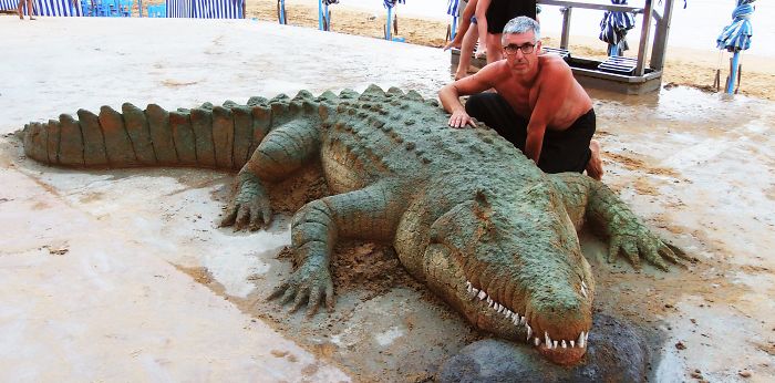realistic crocodile sand sculpture